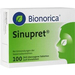 Eine grün-weiße Packung Sinupret-Tabletten gegen Nebenhöhlenentzündungen.